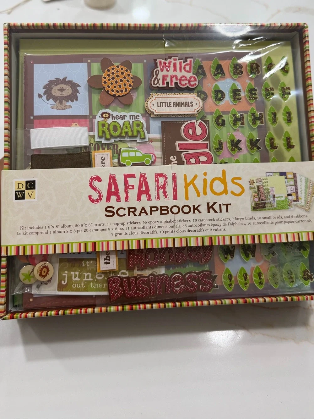Safari Kids Scrapbook Kit with cartoon animals on colored backgrounds